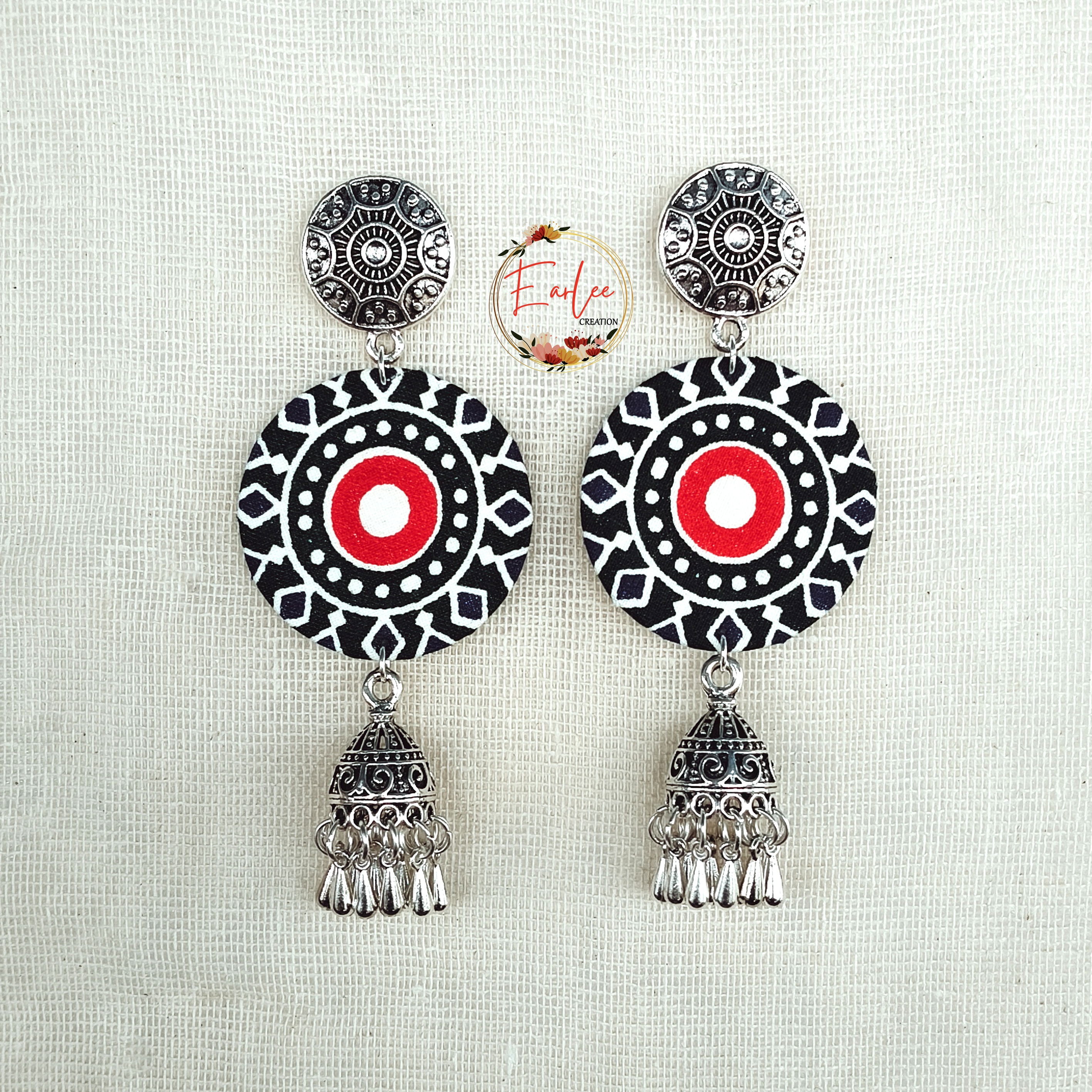 Silver-toned metallic studs and dangling jhumka